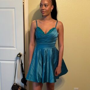 Cute, sexy, short formal dress in the color teal